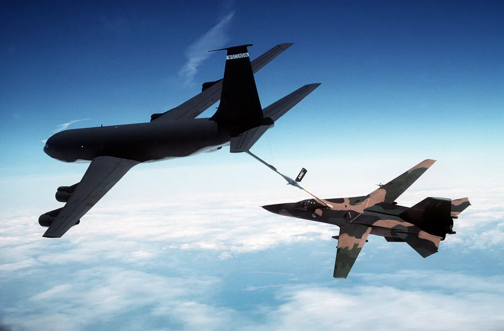 A fighter jet refueling in mid-air from a NATO tanker.